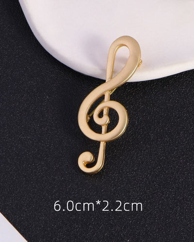 Elegant treble clef broach